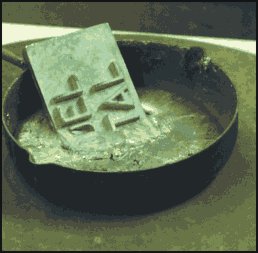 Melt the metal over a electric hob. Use dry metal